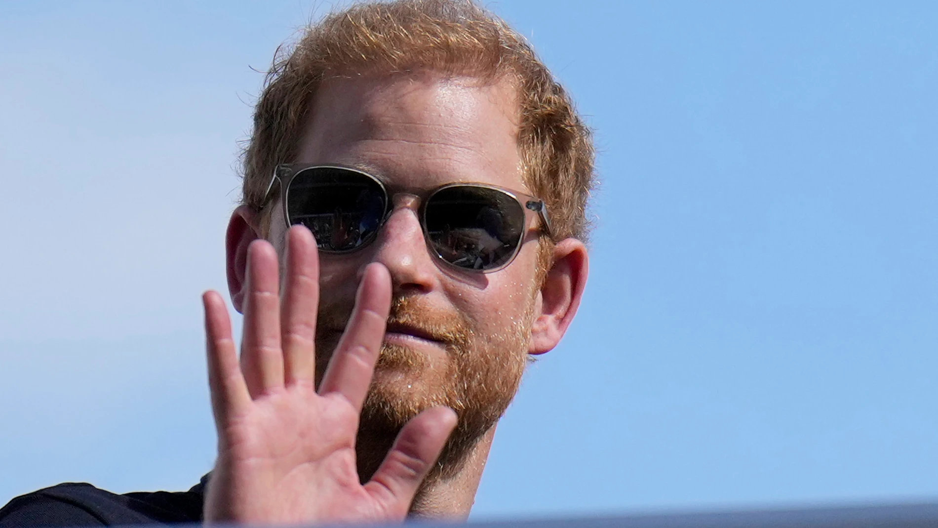 FILE - Britain's Prince Harry, the Duke of Sussex, waves during the Formula One U.S. Grand Prix auto race at Circuit of the Americas, on Oct. 22, 2023, in Austin, Texas. Prince Harry, the son of King Charles III and fifth in line to the British throne, has formally confirmed his is now a U.S. resident. Four years after Harry and his American wife, Meghan, decamped to a villa on the Southern California coast, a travel company he controls filed paperwork informing British authorities that he ha...