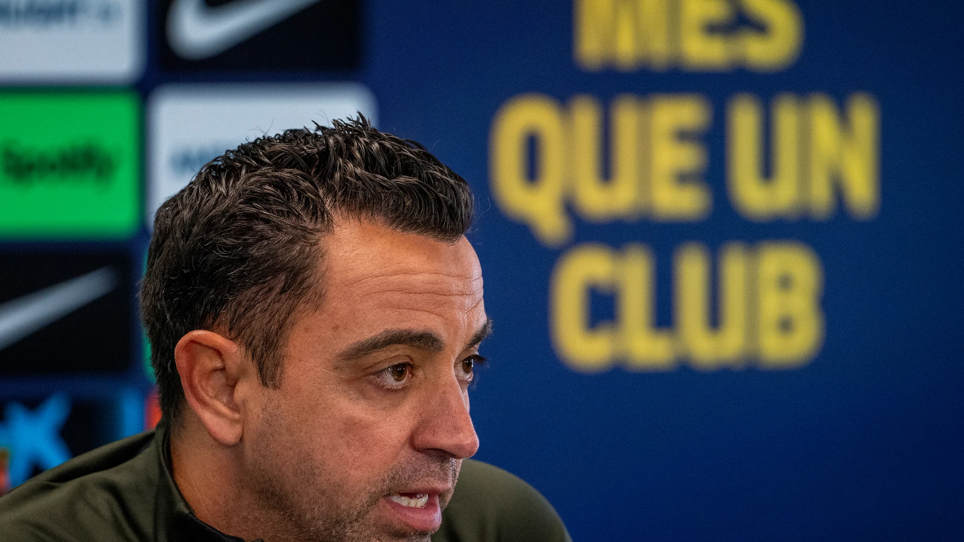 Barcelona's head coach Xavi Hernandez speaks during a press conference in Barcelona, Spain, Thursday, April 25, 2024. Coach Xavi Hernández will stay with Barcelona for another year after all. He has agreed with the club to finish his contract to 2025 after having decided to quit at the end of the season. (AP Photo/Emilio Morenatti)