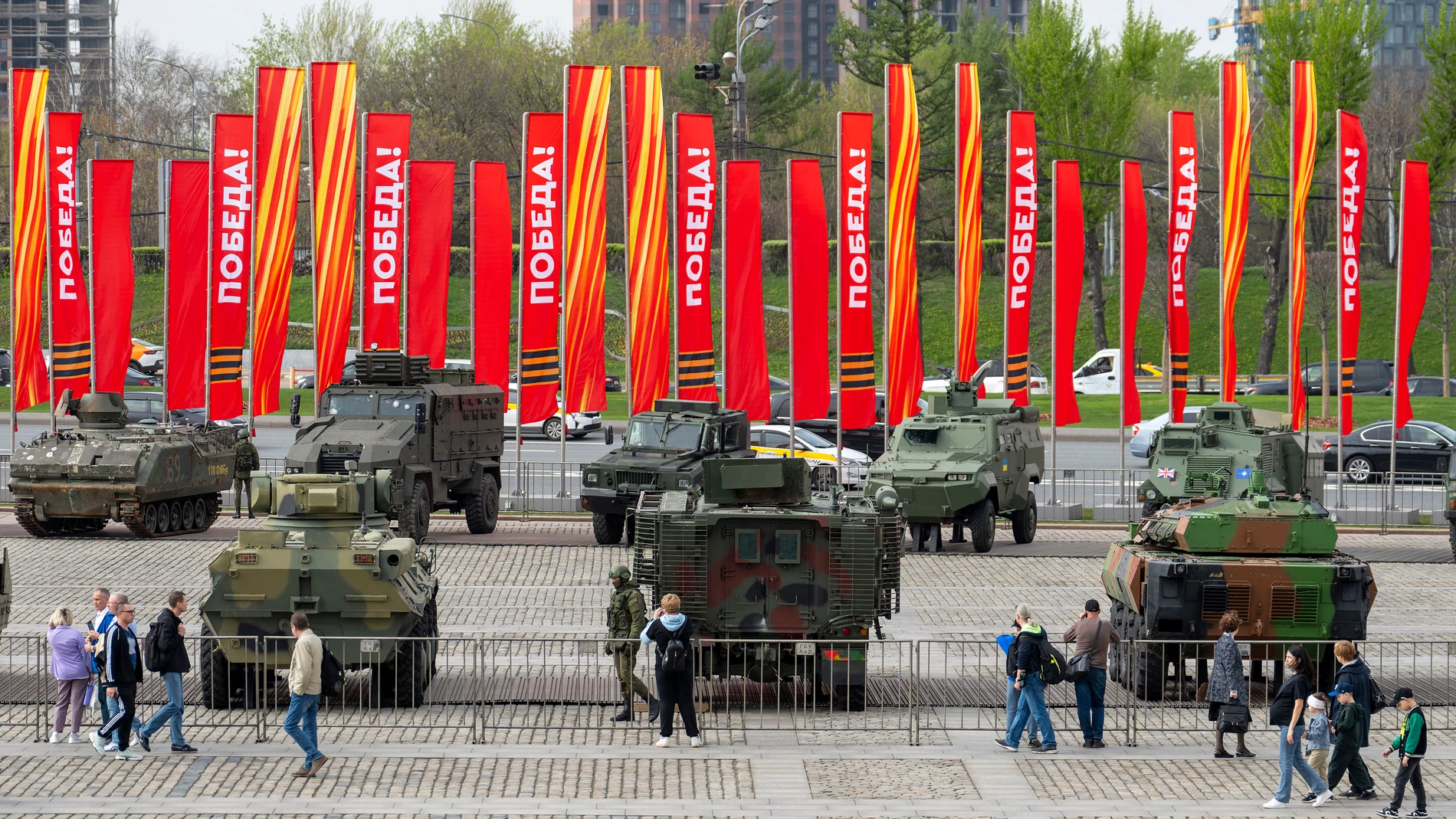 People visit an exhibition of tanks, APCs and guns of Ukrainian armed forces captured during the fighting displayed near the World War II museum on Poklonnaya Hill in Moscow, Russia, Friday, April 26, 2024. (AP Photo/Dmitry Serebryakov)