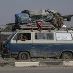 Internally displaced Palestinians leave Rafah following evacuation order