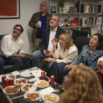 Socialist candidate Salvador Illa, left, watches early results on TV with other members of the PSC ( Socialist Party of Catalonia ) at the party headquarters in Barcelona, Sunday May 12, 2024. 