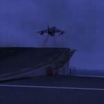 Imagen de un Harrier despegando del Juan Carlos I al anochecer