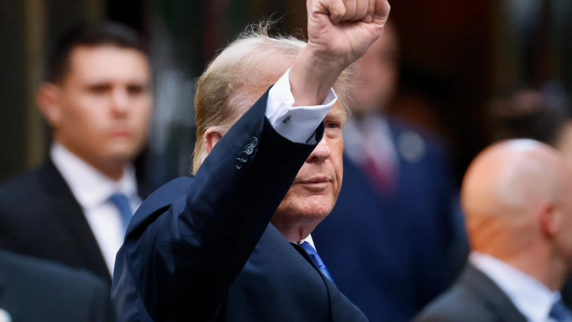 Former US President Donald Trump gestures to the media and the crowd outside of Trump Tower after a jury found him guilty on all 34 counts in his criminal trial in New York State Supreme Court in New York, New York, USA, 30 May 2024.