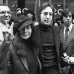 In this April 18, 1972, file photo, John Lennon and his wife, Yoko Ono, leave a U.S. Immigration hearing in New York City.