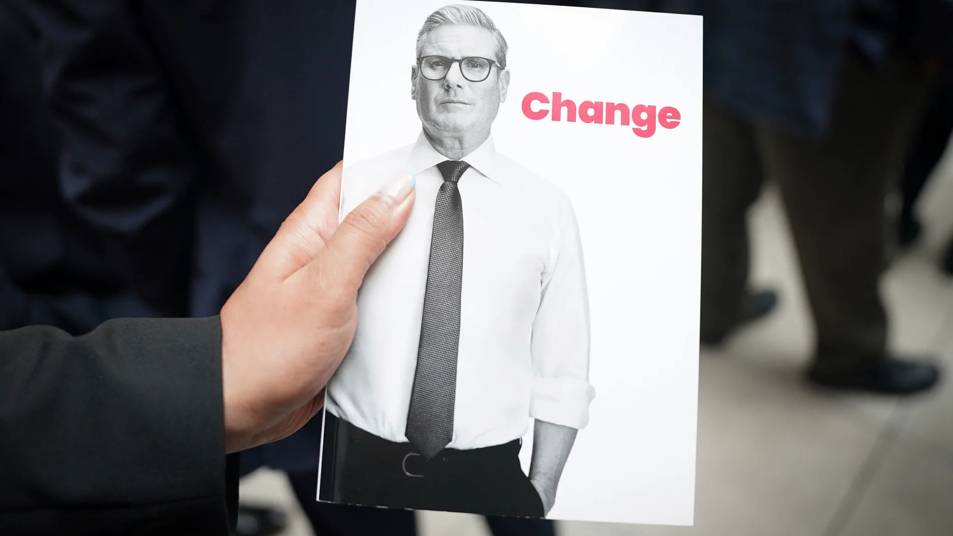 A view of the Britain's Labour Party manifesto with a photo of Labour Leader Keir Starmer, during the launch event at Co-op HQ n Manchester, England, Thursday, June 13, 2024, (Stefan Rousseau/PA via AP)
