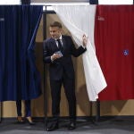 French President Macron votes in second round of parliamentary elections 