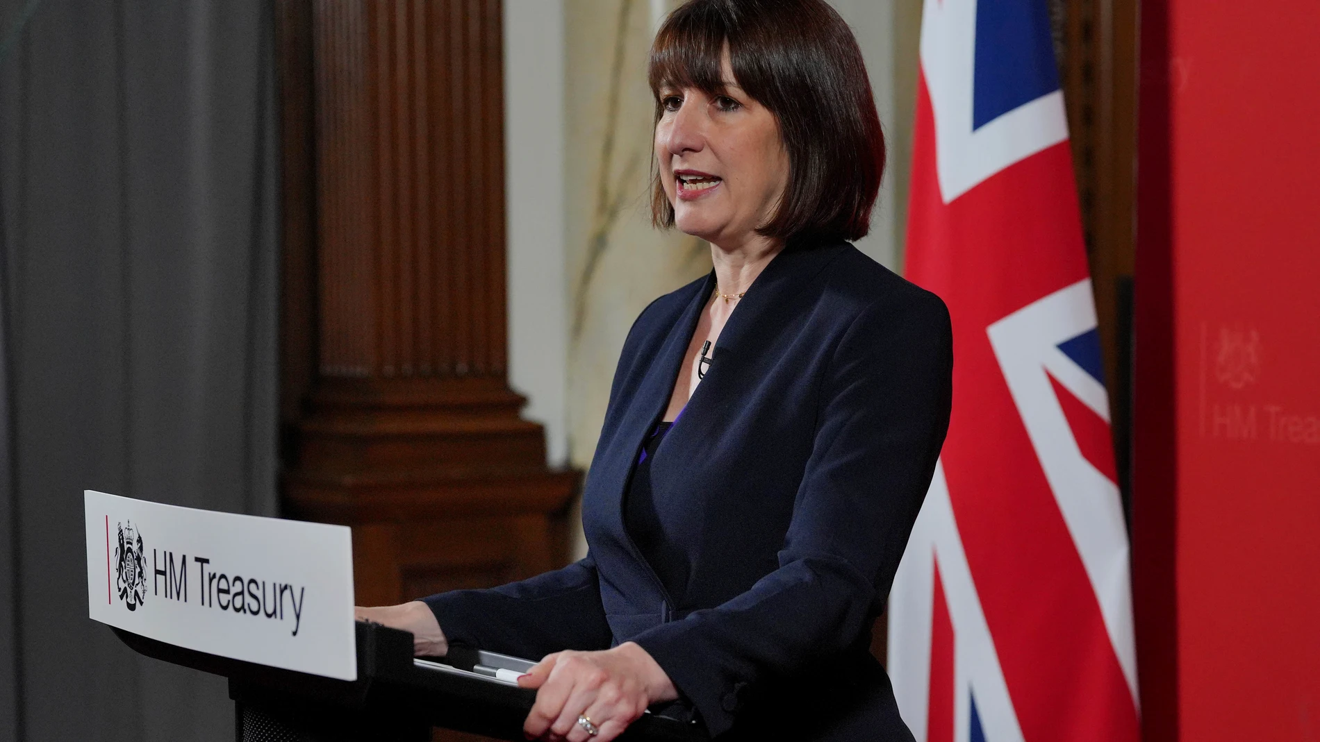 Britain's Chancellor Rachel Reeves delivers a speech at the Treasury to an audience of leading business figures and senior stakeholders, announcing the first steps the new government will be taking to deliver economic growth, in London, Monday July 8, 2024. (Jonathan Brady/Pool Photo via AP)