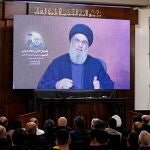 Hezbollah leader Hassan Nasrallah speaks during memorial service for senior commander
