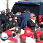 Former US President Donald Trump rushed off stage after incident at campaign rally
