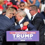 Former US President Donald Trump rushed off stage after incident at campaign rally