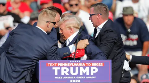 Former US President Donald Trump rushed off stage after incident at campaign rally