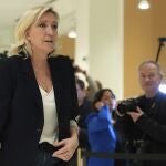 French far-right leader Marine Le Pen returns to the courtroom after a break on the last day of the trial on charges of embezzling European Parliament funds, Wednesday, Nov. 27, 2024 in Paris. 