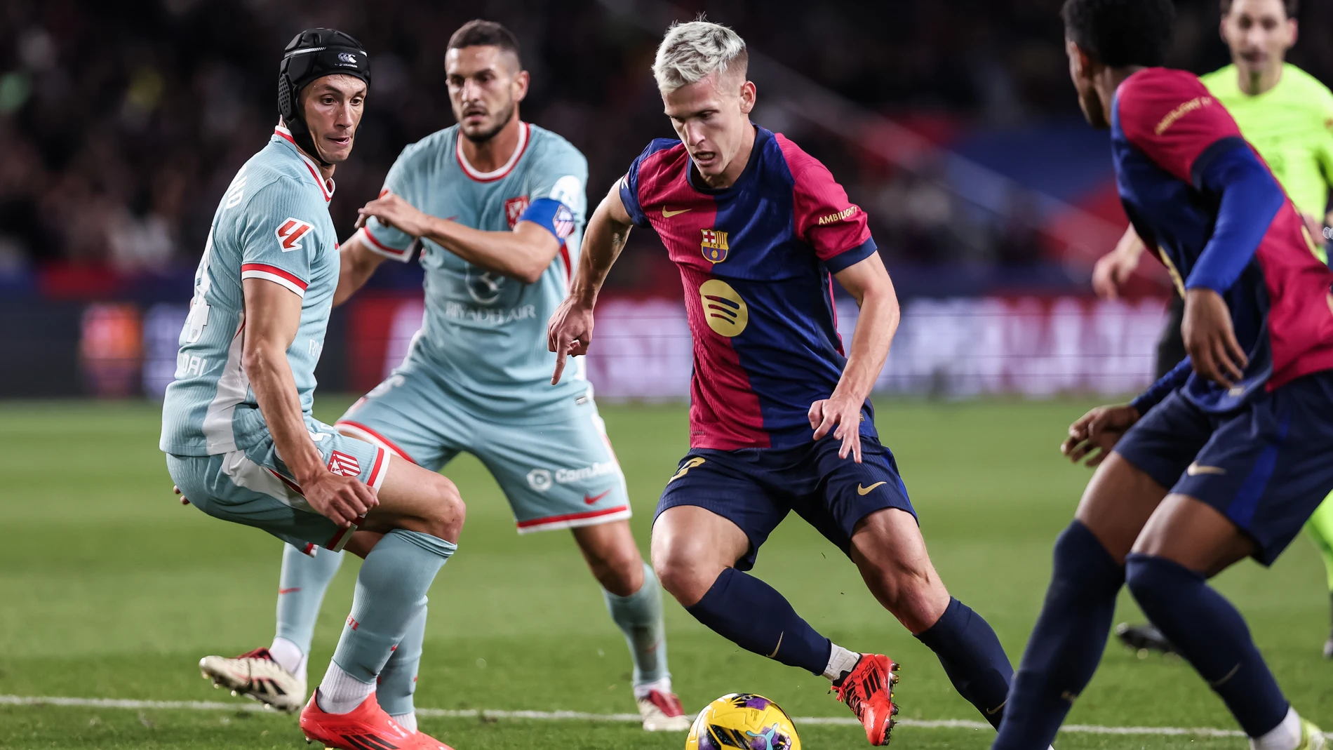 Dani Olmo of FC Barcelona and Robin Le Normand of Atletico de Madrid in action during the Spanish league, La Liga EA Sports, football match played between FC Barcelona and Atletico de Madrid at Estadio Olimpico de Montjuic on December 21, 2024 in Barcelona, Spain.AFP7 21/12/2024 ONLY FOR USE IN SPAIN