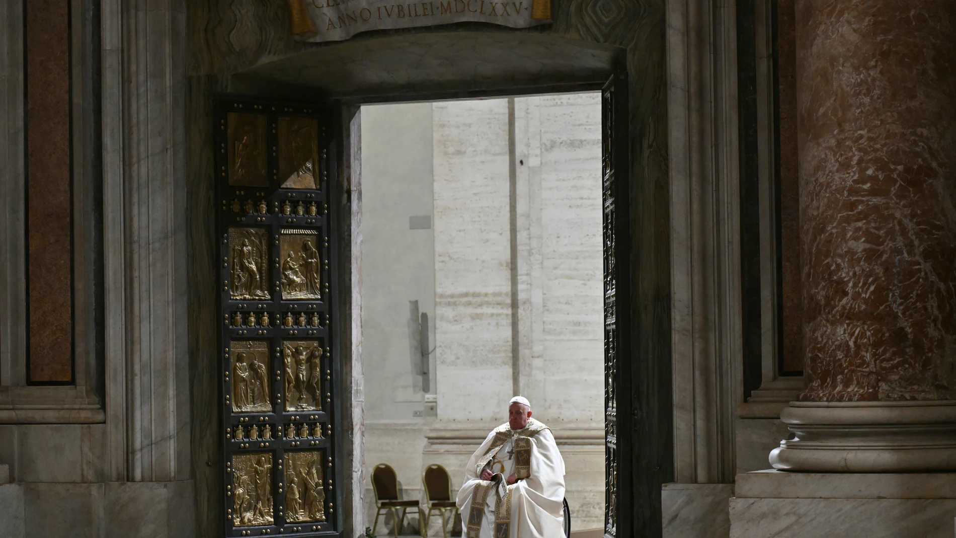 Pope Francis opens the Holy Door of St Peter's Basilica to mark the start of the Catholic Jubilee Year, at the Vatican, Dec. 24, 2024. (Alberto Pizzoli/Pool Photo via AP)