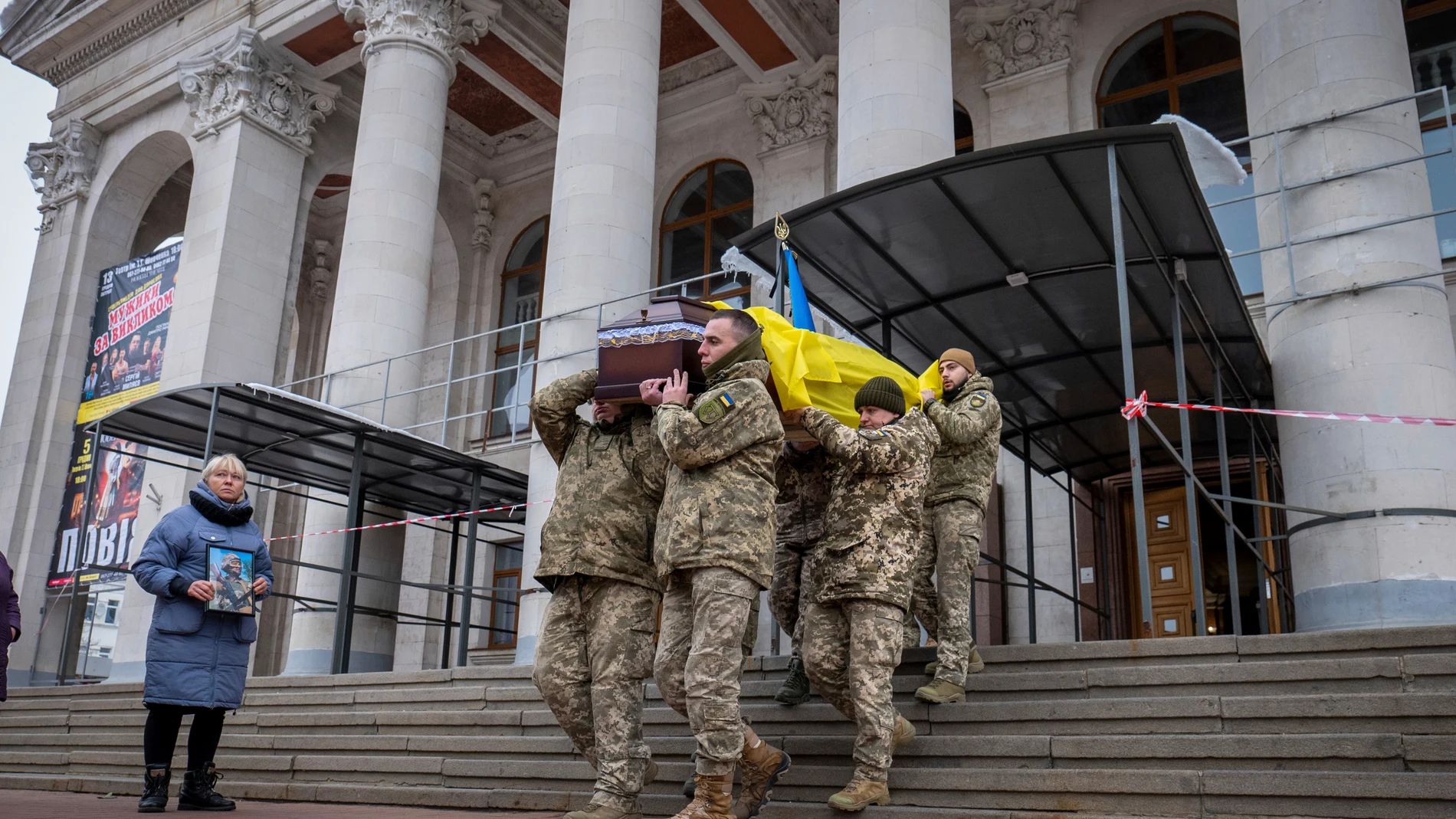 FILE - Fellow soldiers carry Petro Velykiy's coffin during a funeral, Nov. 27, 2024, at the theater in Chernyhiv, Ukraine, for the 48-year-old actor who was killed in a battle with Russian troops in the Kursk region. (AP Photo/Dan Bashakov, File)