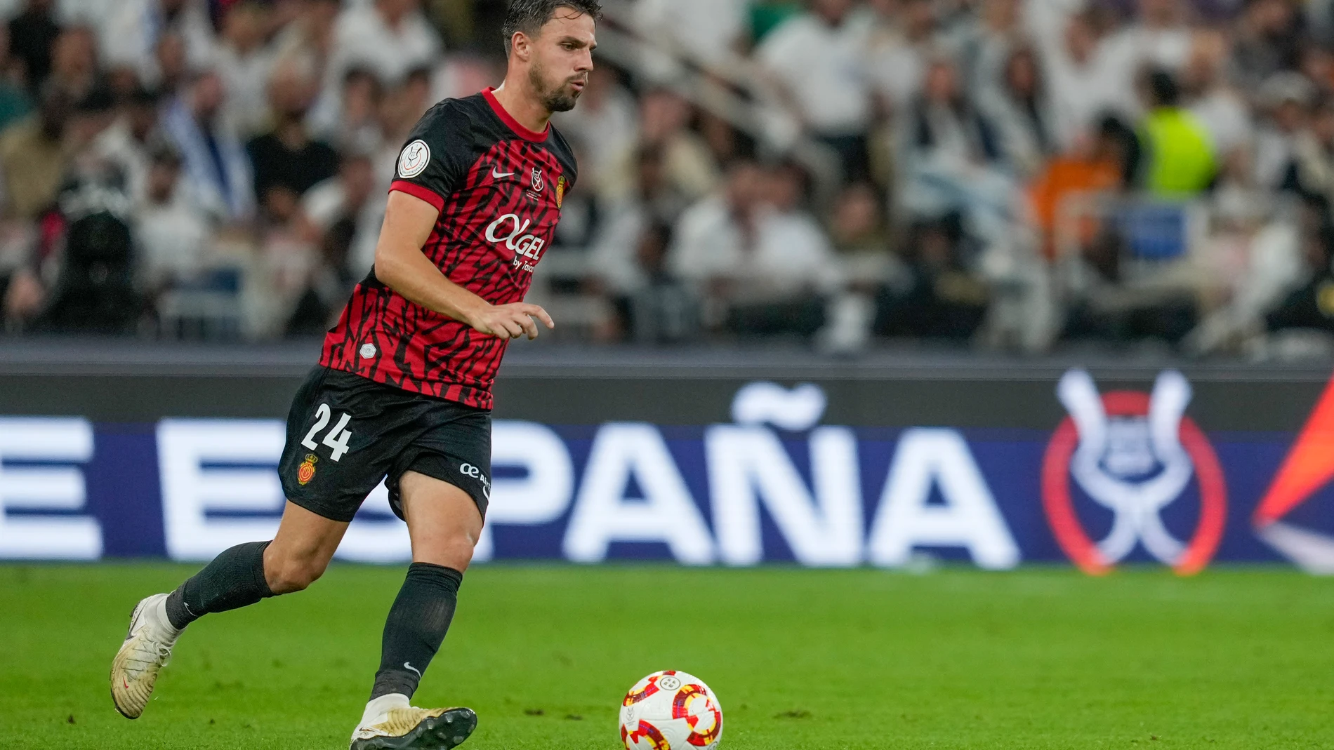 Mallorca's Martin Valjent is in action during the Spanish Super Cup semifinal soccer match between Real Madrid and Mallorca at the King Abdullah Stadium in Jeddah, Saudi Arabia, Thursday, Jan. 9, 2025. (AP Photo/Altaf Qadri)