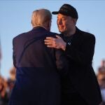 Republican presidential nominee former President Donald Trump hugs Elon Musk at a campaign rally at the Butler Farm Show, Saturday, Oct. 5, 2024, in Butler, Pa.