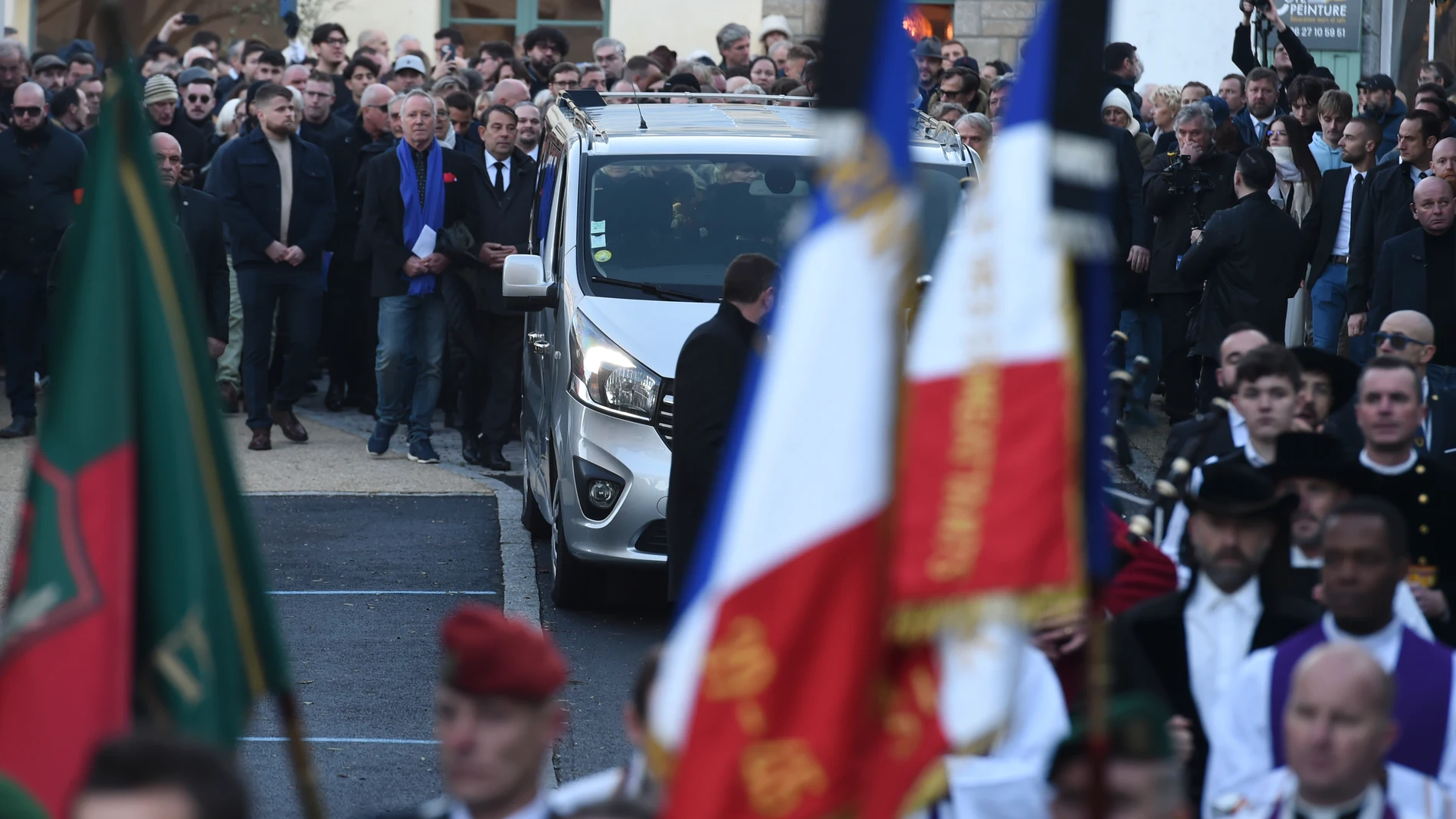 Family members and friends walks behind the hearse transporting the coffin that contains the remains of former far-right National Front party leader Jean-Marie Le Pen, in Trinite-sur-Mer, western France, Saturday, Jan. 11, 2025. (AP Photo/Mathieu Pattier)