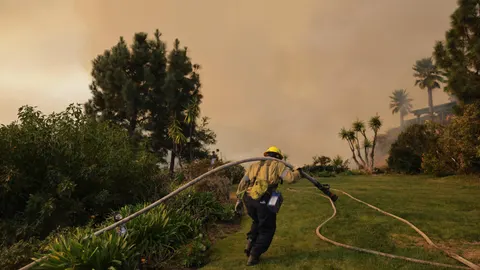Wildfires continue to rage through Los Angeles area