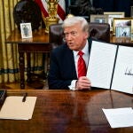 US President Trump signs executive order in Oval Office