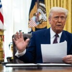 US President Trump signs executive order in the Oval Office at the White House