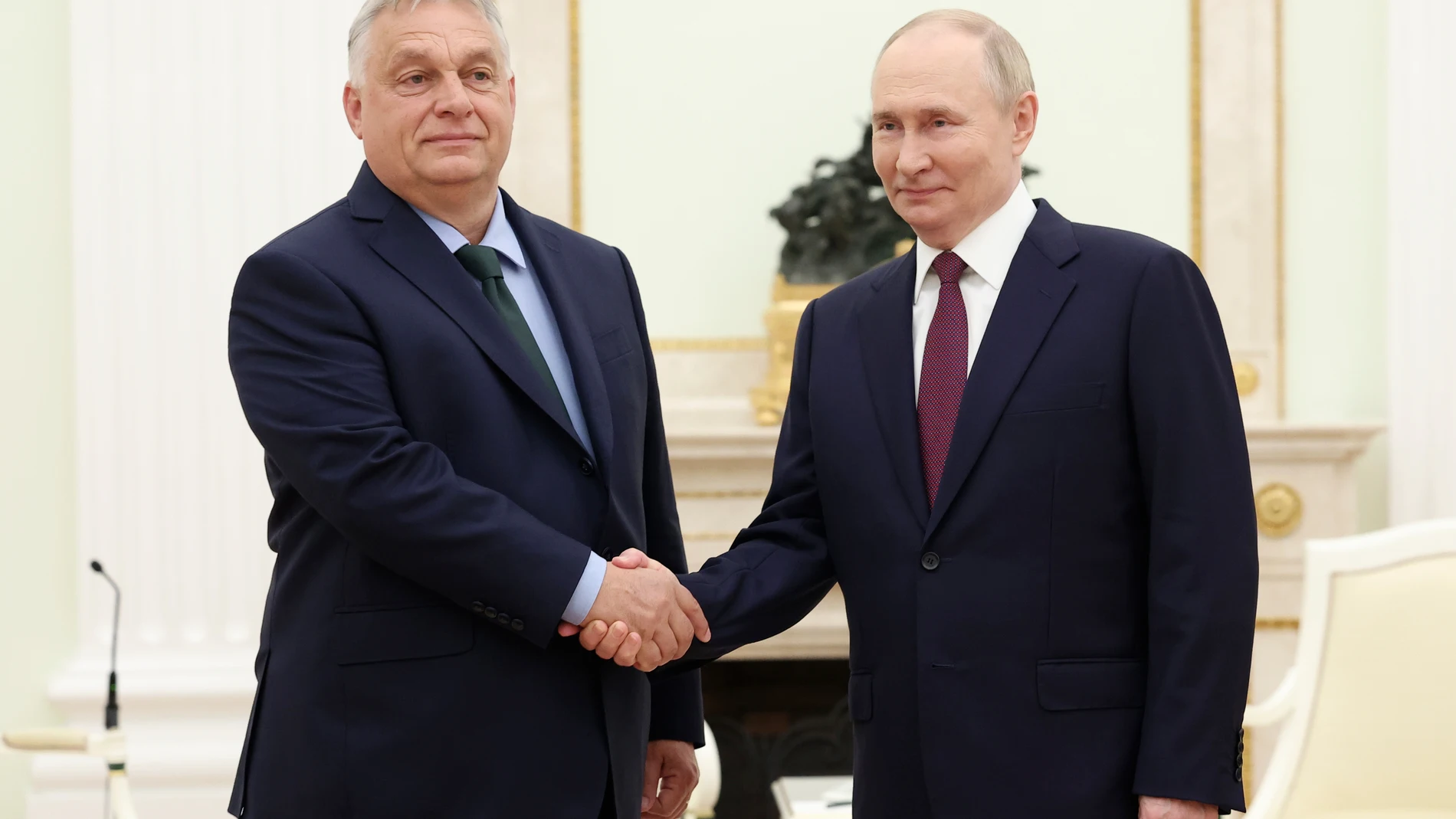 FILE - Russian President Vladimir Putin, right, and Hungarian Prime Minister Viktor Orban shake hands during a meeting in Moscow, July 5, 2024. (Valeriy Sharifulin, Sputnik, Kremlin Pool Photo via AP)