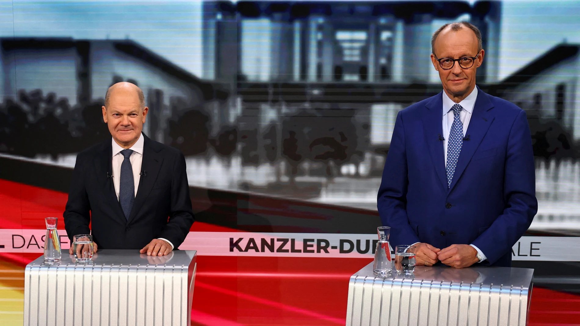 Olaf Scholz, German Chancellor of the Social Democratic Party (SPD), left, and Friedrich Merz, right, leader of the Christian Democratic Union (CDU), are pictured in tv studio ahead of a debate in Berlin, Germany, Wednesday, Feb. 19, 2025. (Fabrizio Bensch/Pool Photo via AP)