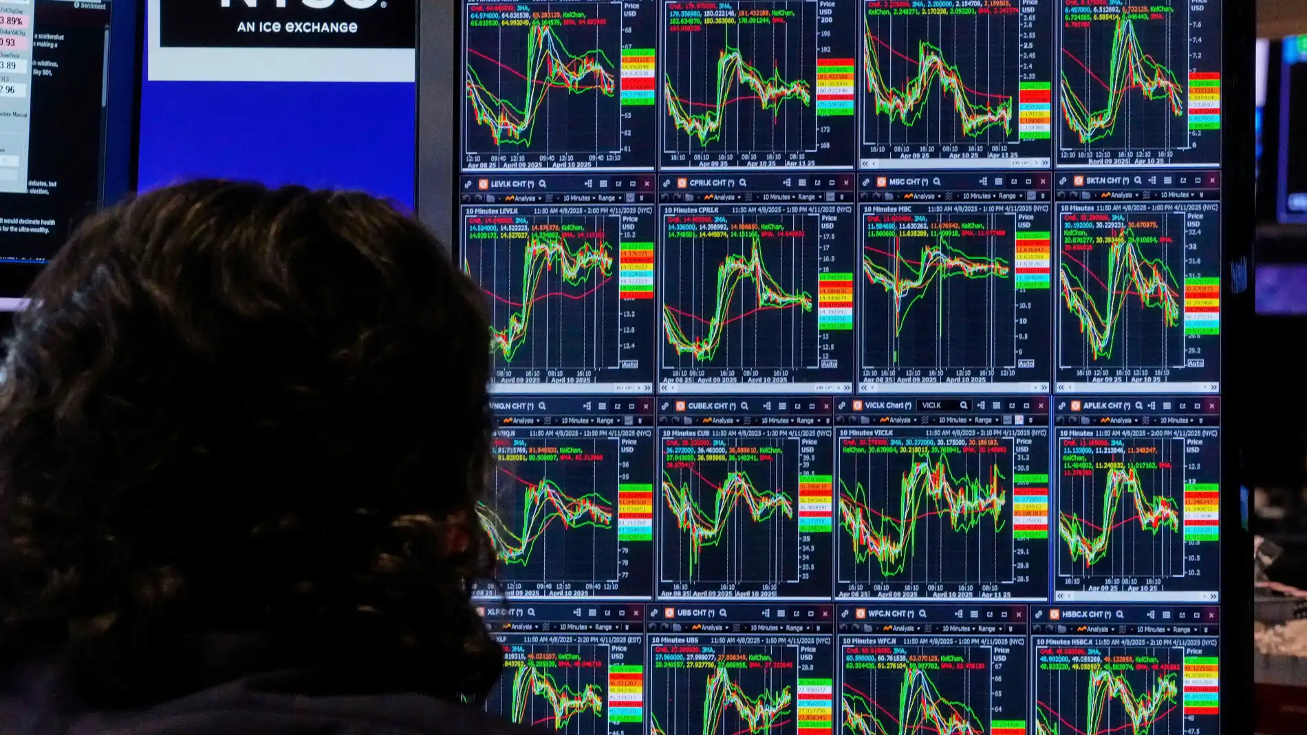 Specialist Michael Pistillo watches the screens at his post on the floor of the New York Stock Exchange, Friday, April 11, 2025. (AP Photo/Richard Drew)