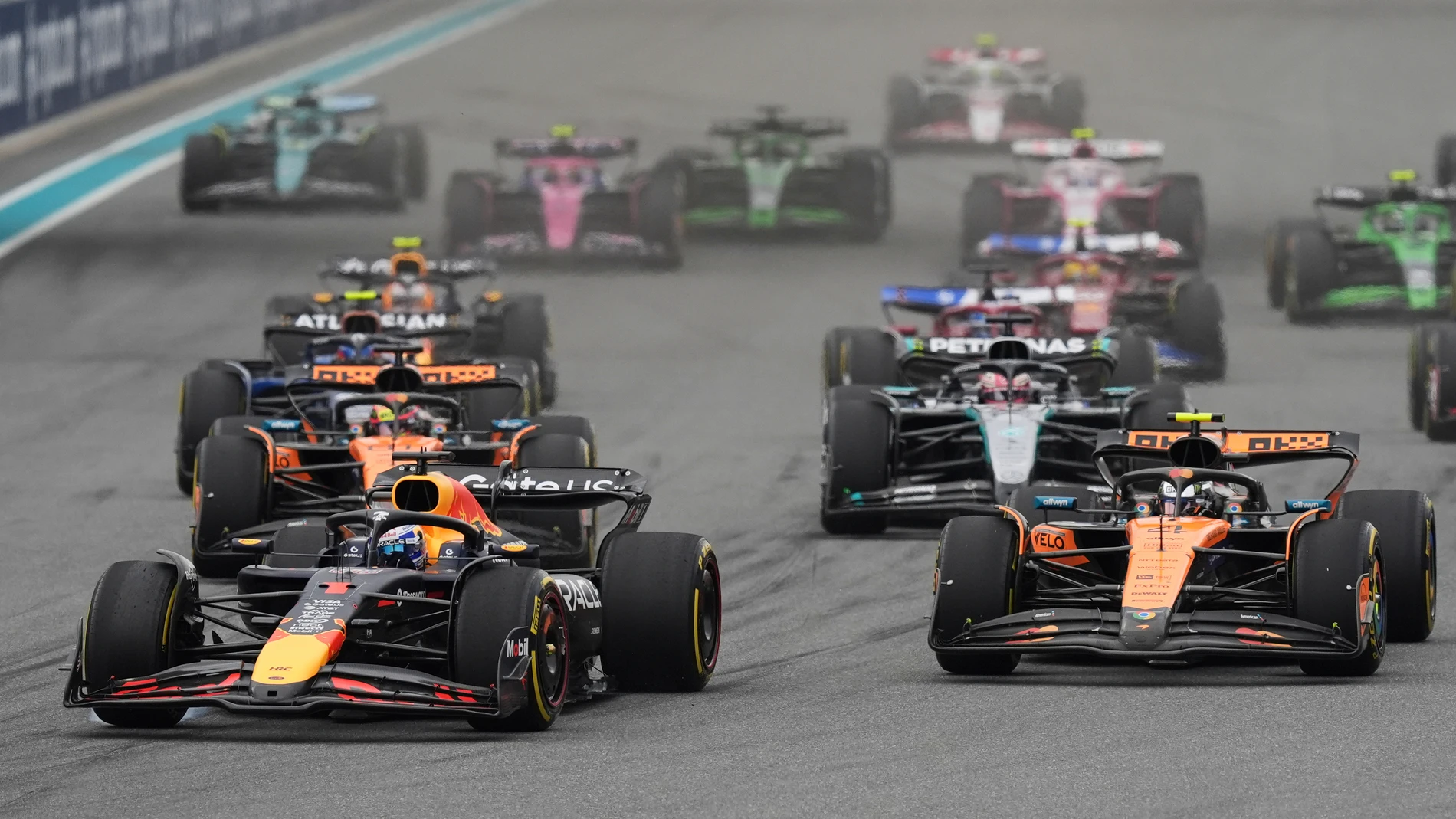Red Bull driver Max Verstappen of the Netherlands, left, leads the field during the Formula One Miami Grand Prix auto race Sunday, May 4, 2025, in Miami Gardens. Fla. (AP Photo/Rebecca Blackwell)