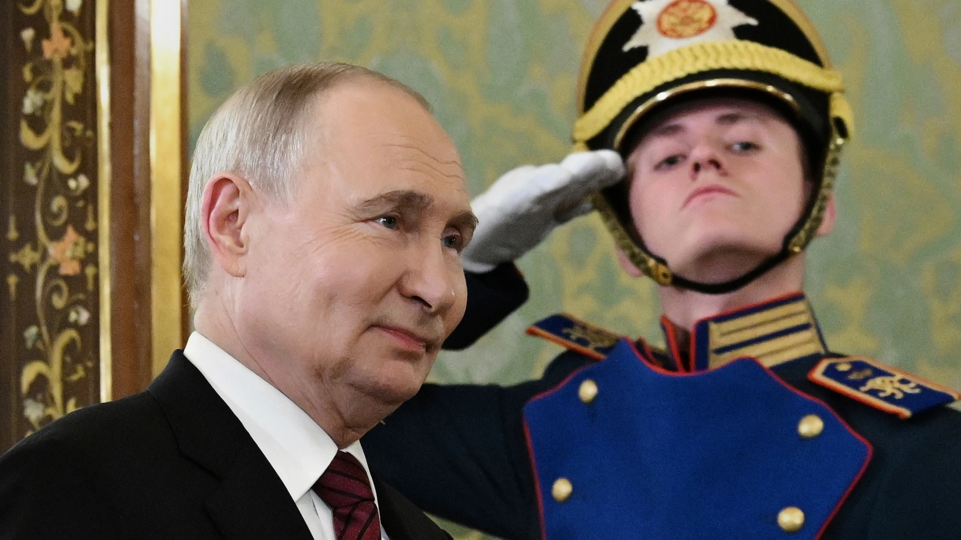 Russian President Vladimir Putin enters a hall to meet South Ossetian President Alan Gagloyev in the Grand Palace at the Kremlin in Moscow, Russia, on Saturday, May 10, 2025, during celebrations of the 80th anniversary of the Soviet Union's victory over Nazi Germany during the World War II. (Sergei Bobylev/RIA Novosti via AP)