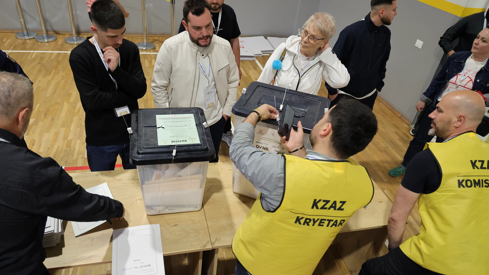 Ballot boxes are checked following the end of the voting procedure in Albania's parliamentary election after a boisterous campaign dominated by the country's uphill effort to join the European Union and Prime Minister Edi Rama's bid for a fourth term, in Tirana, Albania, Sunday, May 11, 2025. (AP Photo/Vlasov Sulaj)