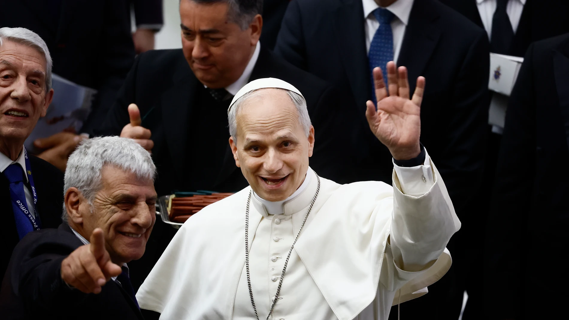 Pope Leo XIV waves to photographers during an audience in the Paul VI Hall at the Vatican on Monday, May 12, 2025, with members of the international media who covered the recent conclave in which he was elected. (Cecilia Fabiano/LaPresse via AP)