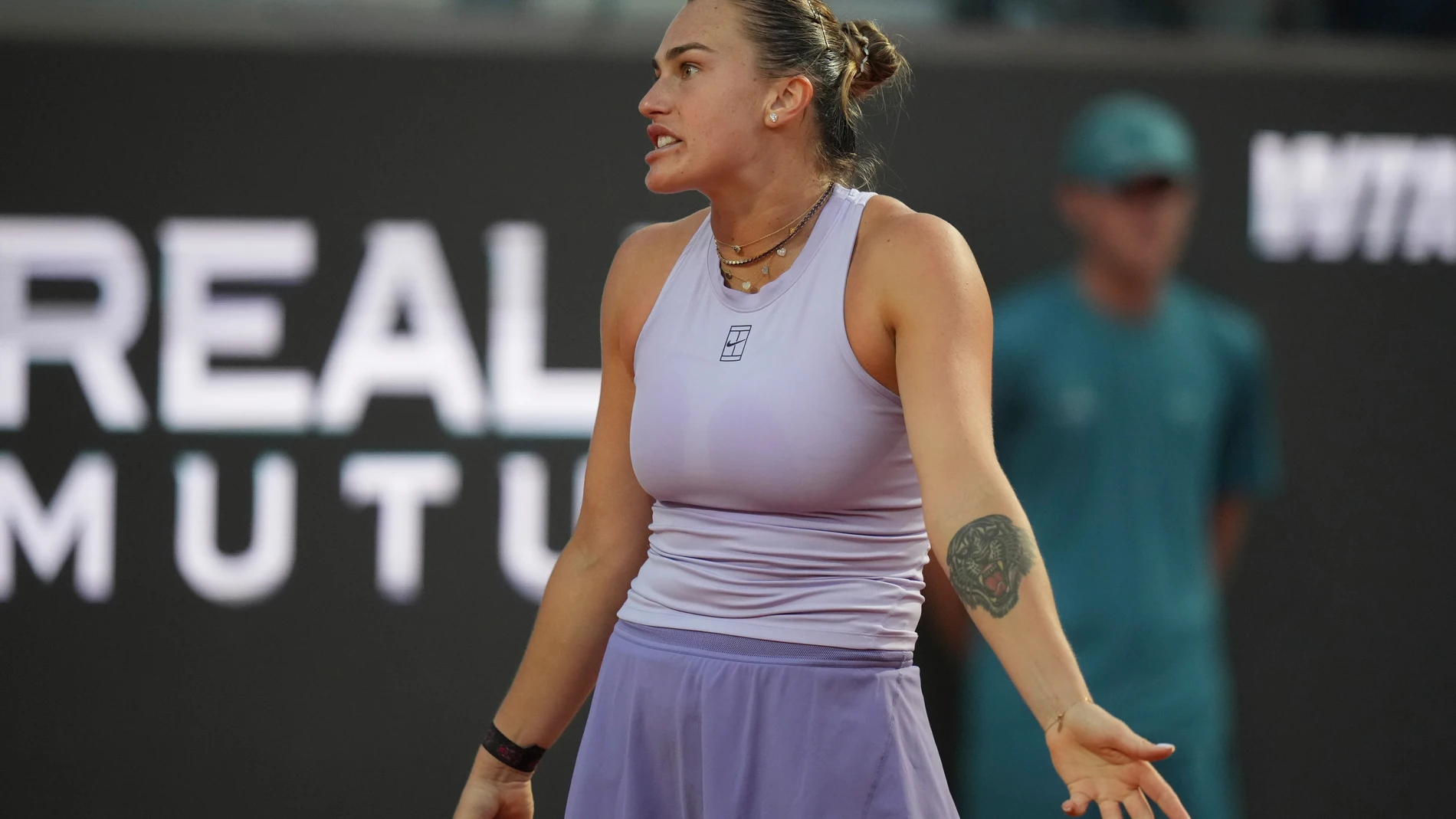 Aryna Sabalenka of Belarus reacts during a quarter-final tennis match against China's Qinwen Zheng at the Italian Open in Rome, Italy, Wednesday, May 14, 2025. (AP Photo/Alessandra Tarantino)