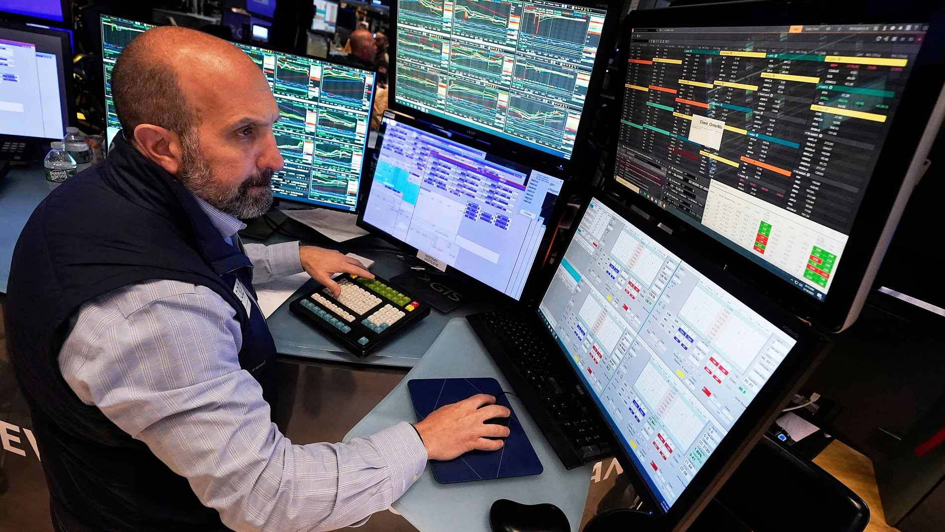 Specialist James Denaro works at his post on the floor of the New York Stock Exchange, Wednesday, May 14, 2025. (AP Photo/Richard Drew)