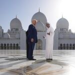 President Donald Trump speaks to Yousif Al Obaidli, director of Sheikh Zayed Grand Mosque, as he tours along with UAE President Mohammed bin Zayed Al Nahyan, left, the Sheikh Zayed Grand Mosque, Thursday, May 15, 2025, in Abu Dhabi, United Arab Emirates. 