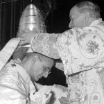  In this file photo taken on June 30, 1963, Alfredo Cardinal Ottaviani, Italian member of the Vatican Curia, places the Tiara Crown on the head of Pope Paul VI during the coronation ceremony outdoor, in front of St. Peter's. 