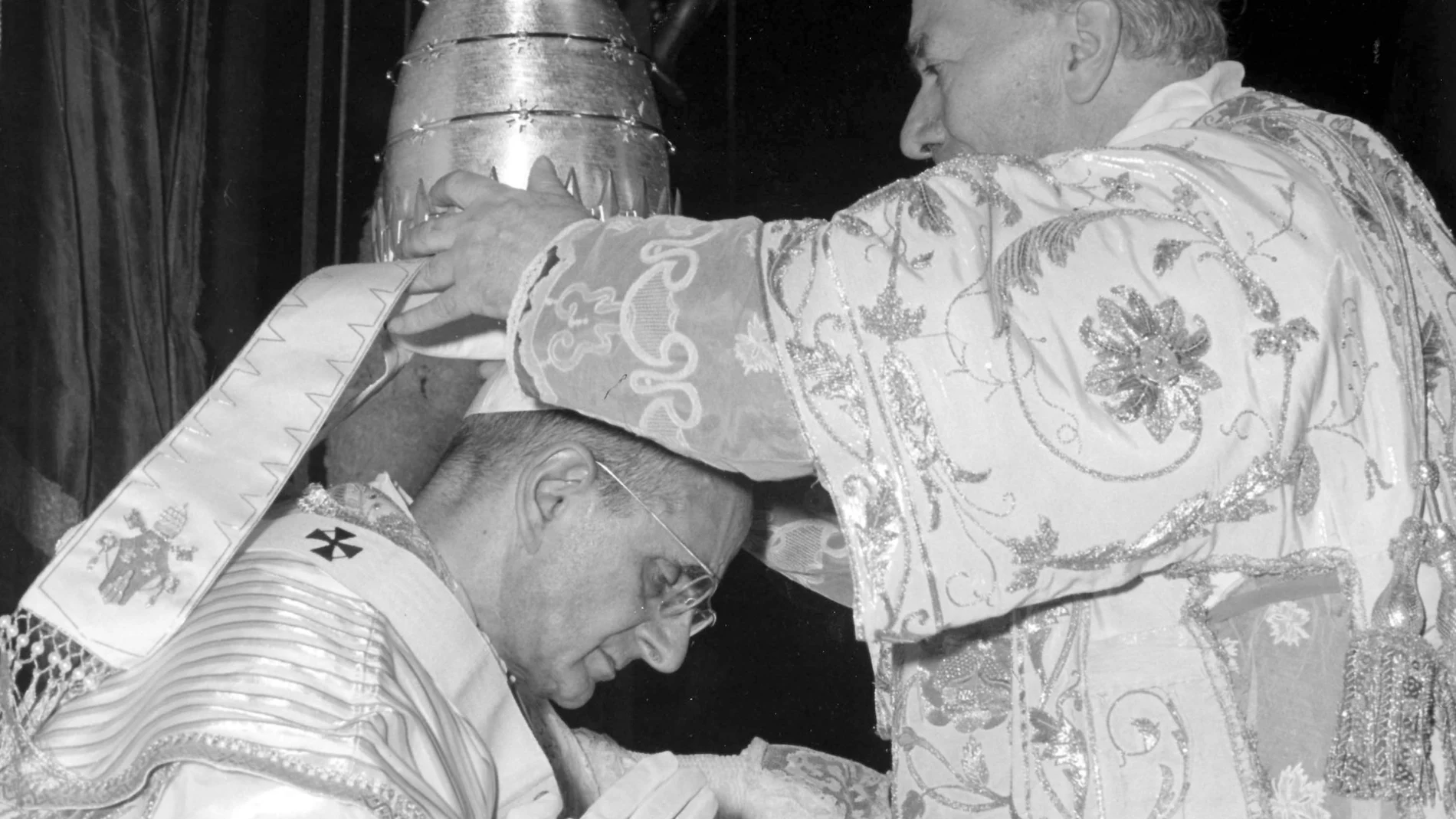 In this file photo taken on June 30, 1963, Alfredo Cardinal Ottaviani, Italian member of the Vatican Curia, places the Tiara Crown on the head of Pope Paul VI during the coronation ceremony outdoor, in front of St. Peter's.