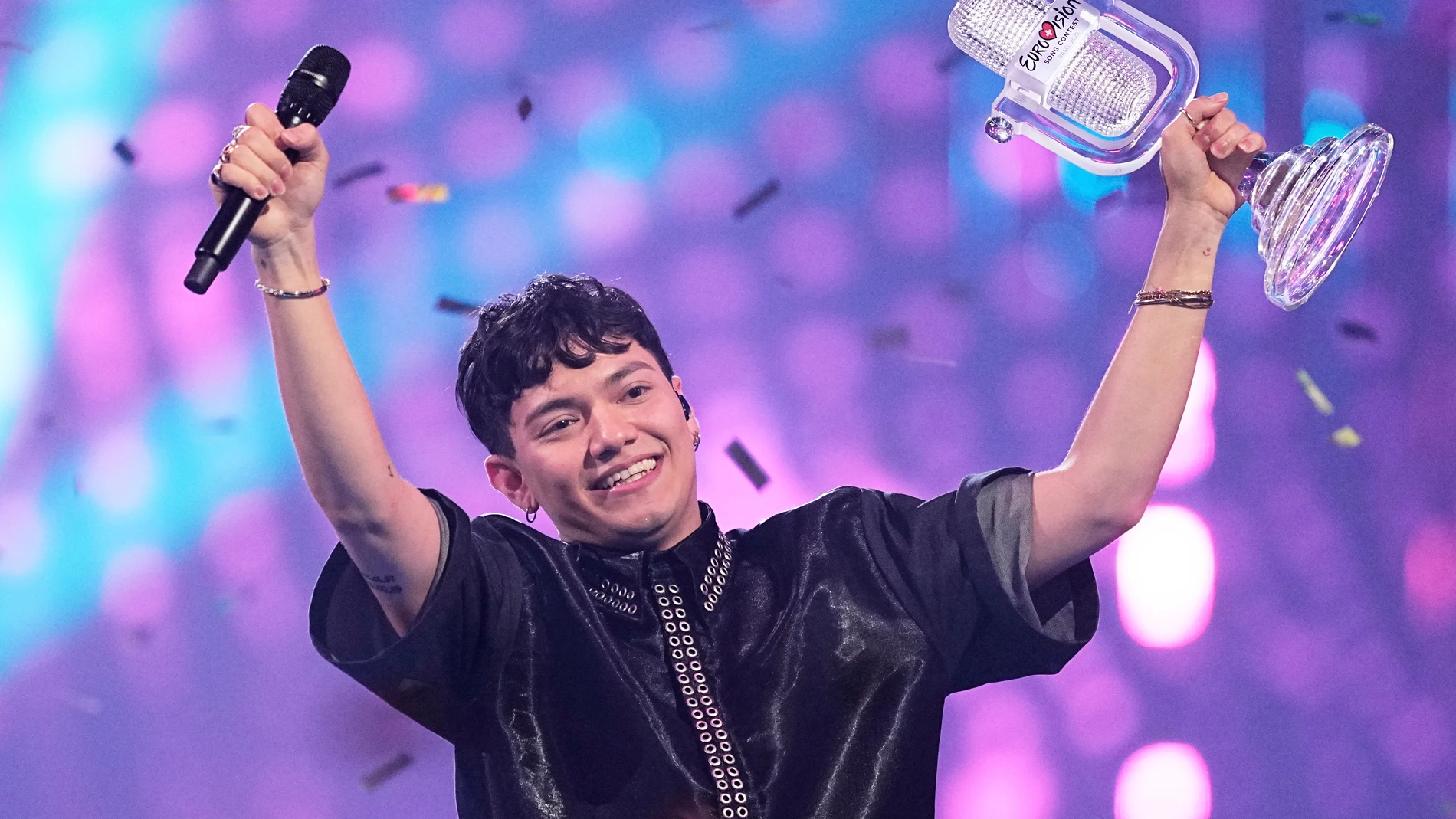 Winner of the Eurovision Song Contest JJ from Austria holds up the trophy onstage, he won with the song "Wasted Love" during the Grand Final of the 69th Eurovision Song Contest, in Basel, Switzerland, Saturday, May 17, 2025. (AP Photo/Martin Meissner)