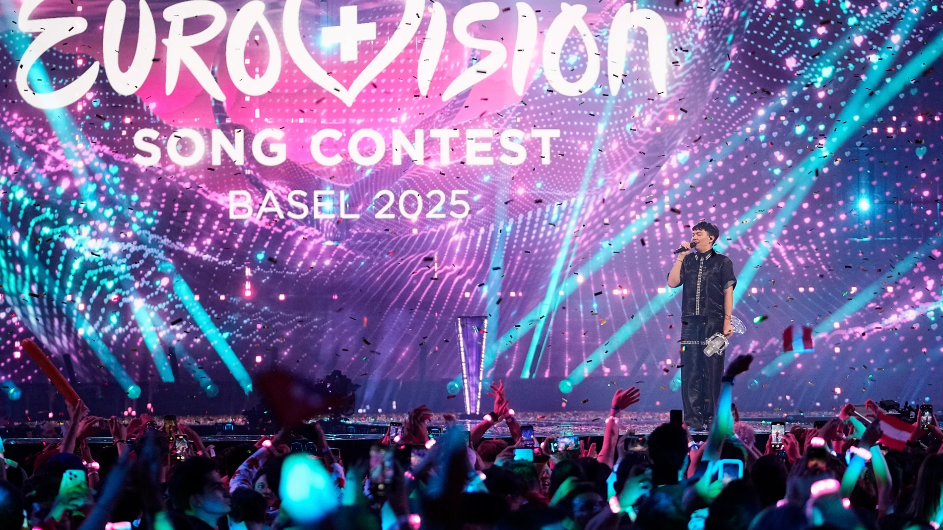 JJ from Austria stands on the stage with the trophy after winning the Grand Final of the 69th Eurovision Song Contest, in Basel, Switzerland, Saturday, May 17 2025. (AP Photo/Martin Meissner)