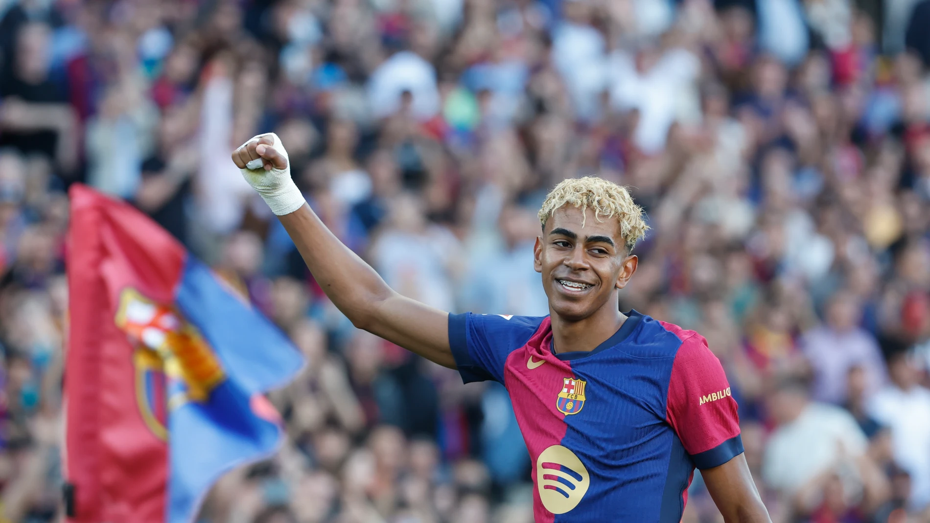 Barcelona's Lamine Yamal celebrates after scoring his side's first goal during the Spanish La Liga soccer match between Barcelona and Villarreal at Lluis Companys Olympic Stadium in Barcelona, Spain, Sunday, May 18, 2025. (AP Photo/Joan Monfort)