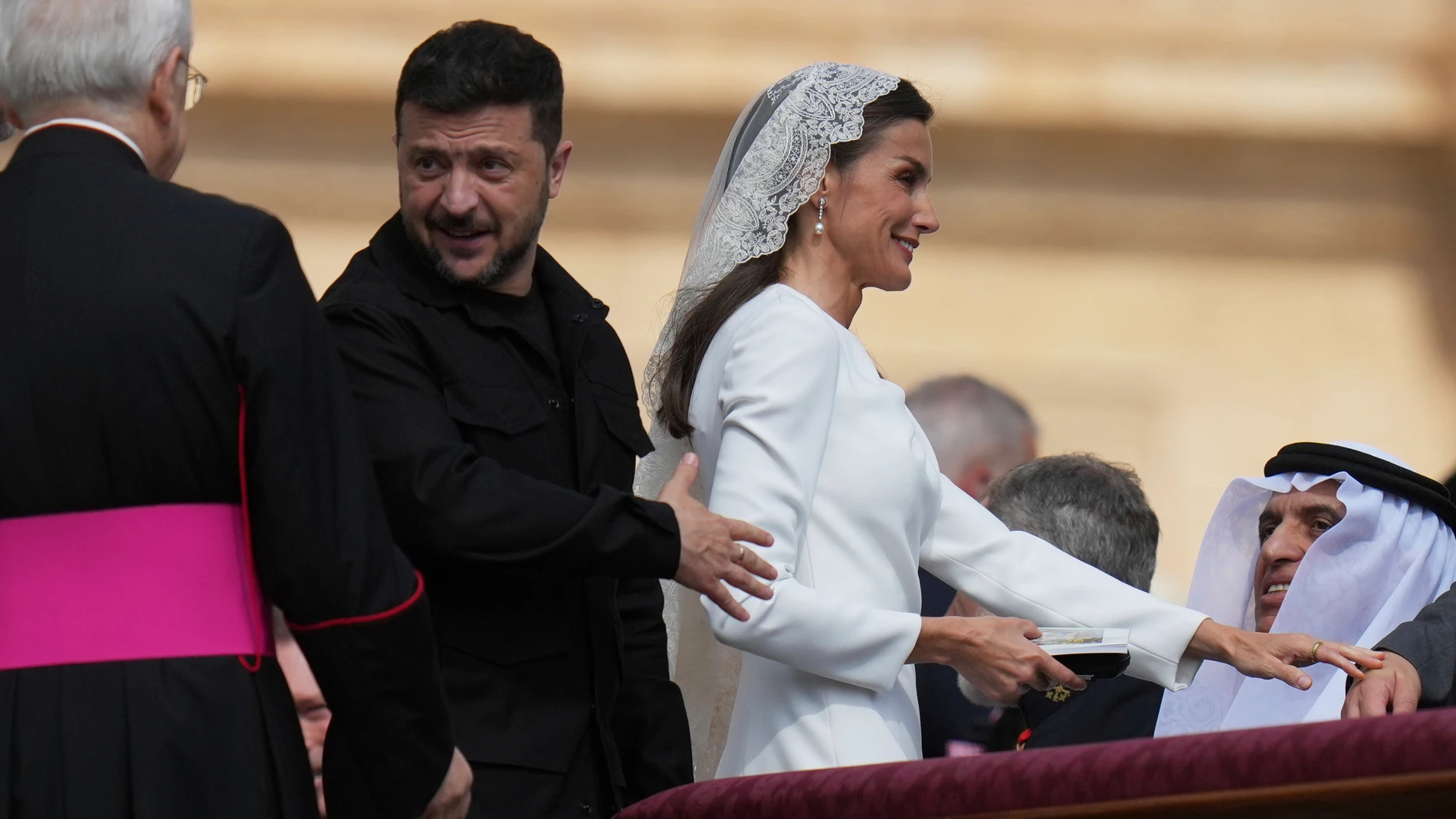 Ukraine's President Volodymr Zelenskyy and Queen Letizia of Spain arrive for the Pope Leo XIV's formal inauguration of his pontificate in St. Peter's Square, at the Vatoican, Sunday, May 18, 2025. (AP Photo/Alessandra Tarantino)