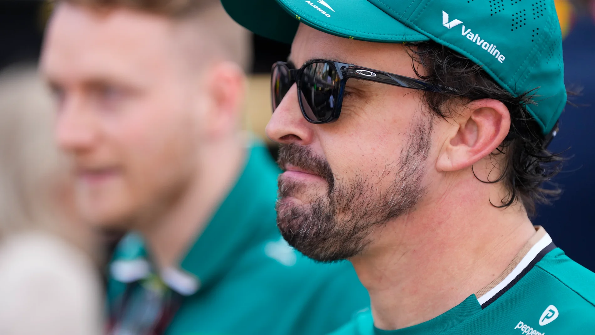 Aston Martin driver Fernando Alonso of Spain walks through the pits after the qualifying session ahead of the Formula One Monaco Grand Prix race at the Monaco racetrack in Monaco, Saturday, May 24, 2025. (AP Photo/Manu Fernandez)