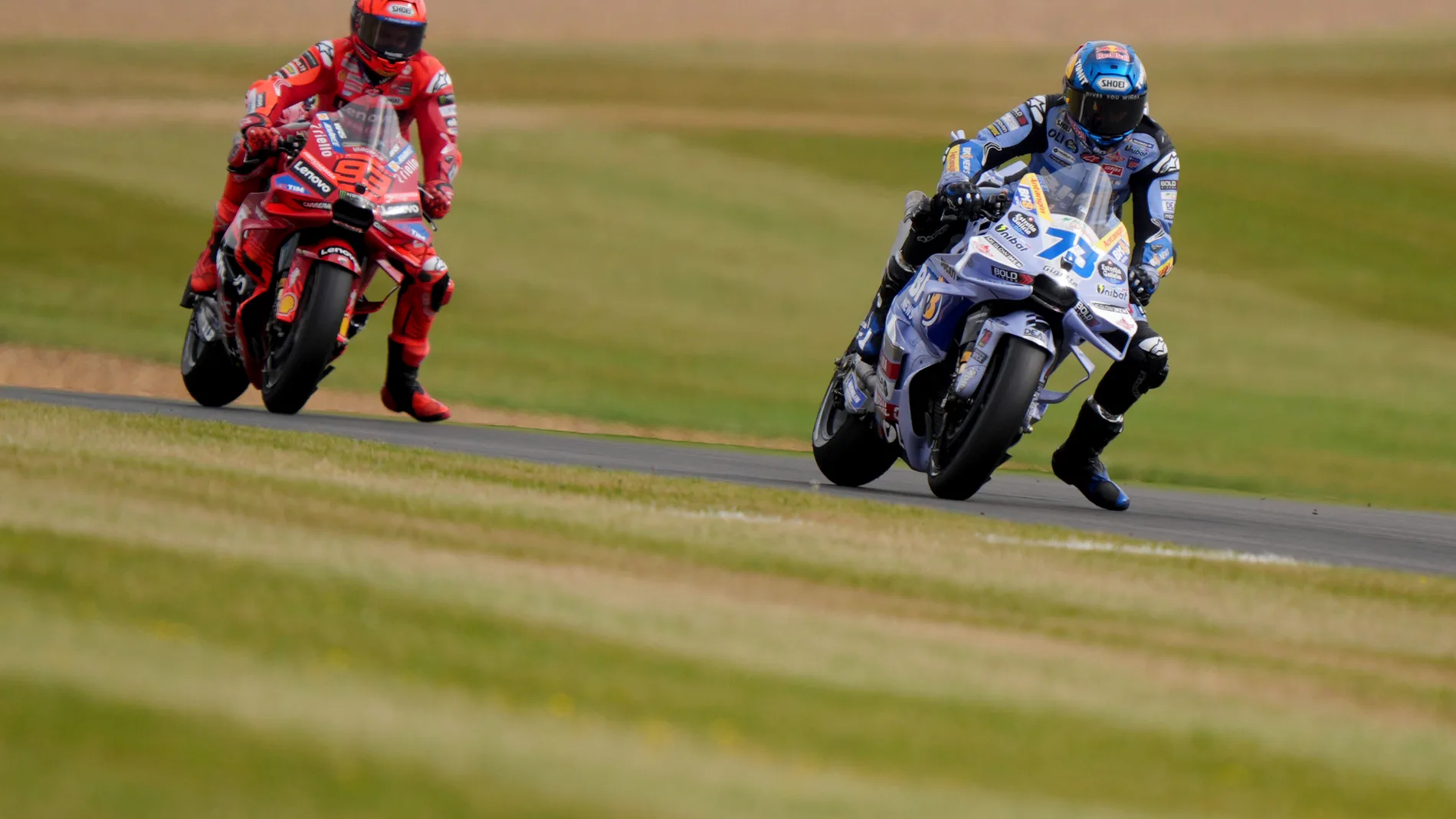 BK8 Gresini Racing MotoGP's Alex Marquez leads the sprint race followed by Ducati Lenovo Team's Marc Marquez during the British Grand Prix MotoGP 2024 at Silverstone, Towcester, England, Saturday May 24, 2025. (Bradley Collyer/PA via AP)