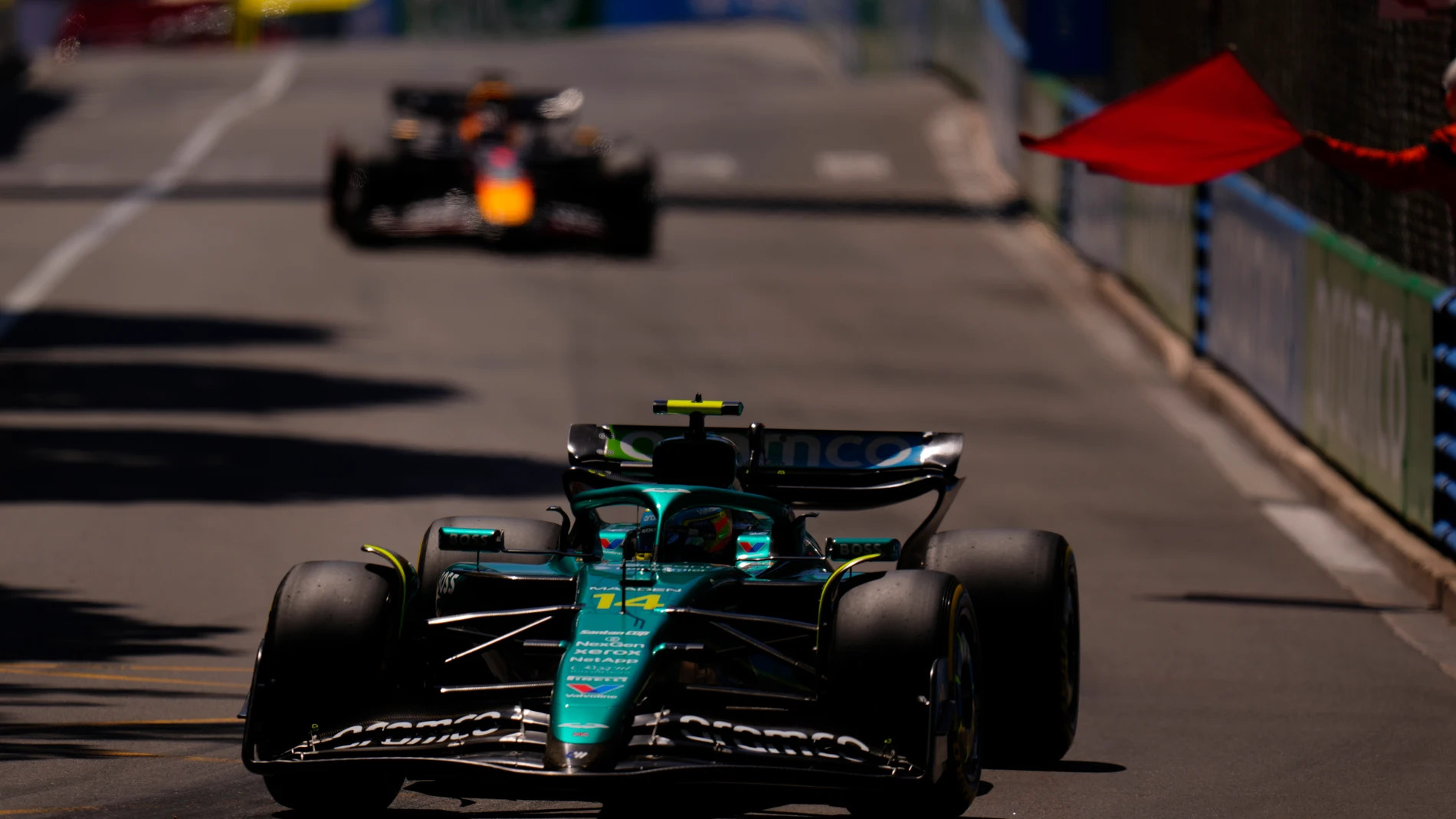 Aston Martin driver Fernando Alonso of Spain steers his car past a red flag during the third free practice ahead of the Formula One Monaco Grand Prix race at the Monaco racetrack in Monaco, Saturday, May 24, 2025. (AP Photo/Manu Fernandez)