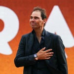 Former Spanish player Rafael Nadal gestures during a ceremony honouring his career during the French Open tennis tournament on Court Philippe-Chatrier at the Roland-Garros Complex in Paris on May 25, 2025. May 23, 2025, marked 20 years since Spain's Raphael Nadal shook Roland Garros with his first match at the French Open, changing the tennis tournament's history forever. Two decades and 14 titles later, the clay court legend, who retired in November 2024, will receive a tribute during the tournament on May 25, 2025. 