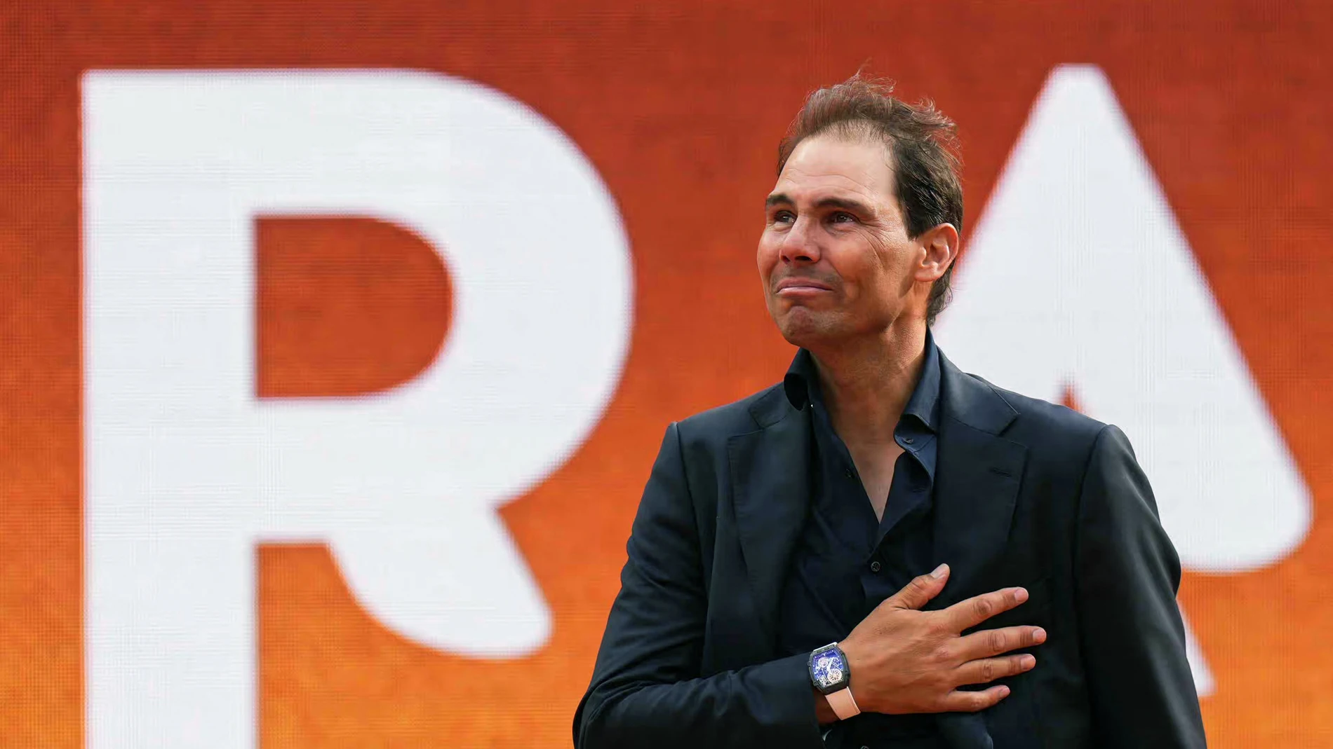 Former Spanish player Rafael Nadal gestures during a ceremony honouring his career during the French Open tennis tournament on Court Philippe-Chatrier at the Roland-Garros Complex in Paris on May 25, 2025. May 23, 2025, marked 20 years since Spain's Raphael Nadal shook Roland Garros with his first match at the French Open, changing the tennis tournament's history forever. Two decades and 14 titles later, the clay court legend, who retired in November 2024, will receive a tribute during the tournament on May 25, 2025.