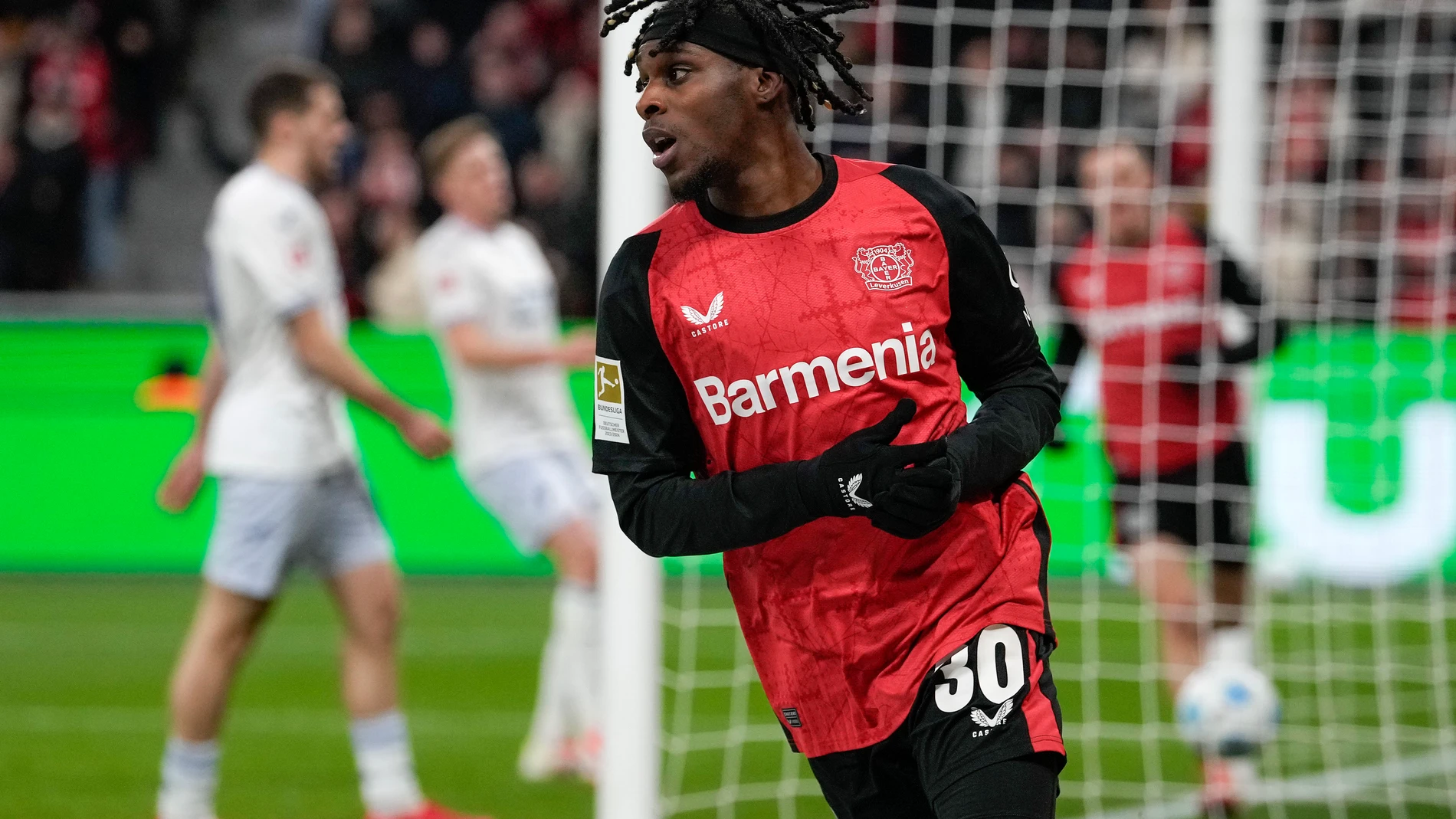 FILE - Leverkusen's Jeremie Frimpong celebrates after he scored his side's second goal during the German Bundesliga soccer match between Bayer Leverkusen and TSG Hoffenheim at the BayArena in Leverkusen, Germany, Sunday, Feb. 2, 2025. (AP Photo/Martin Meissner, File)