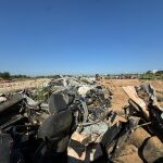 Coches destrozados y abandonados en el barranco del Poyo