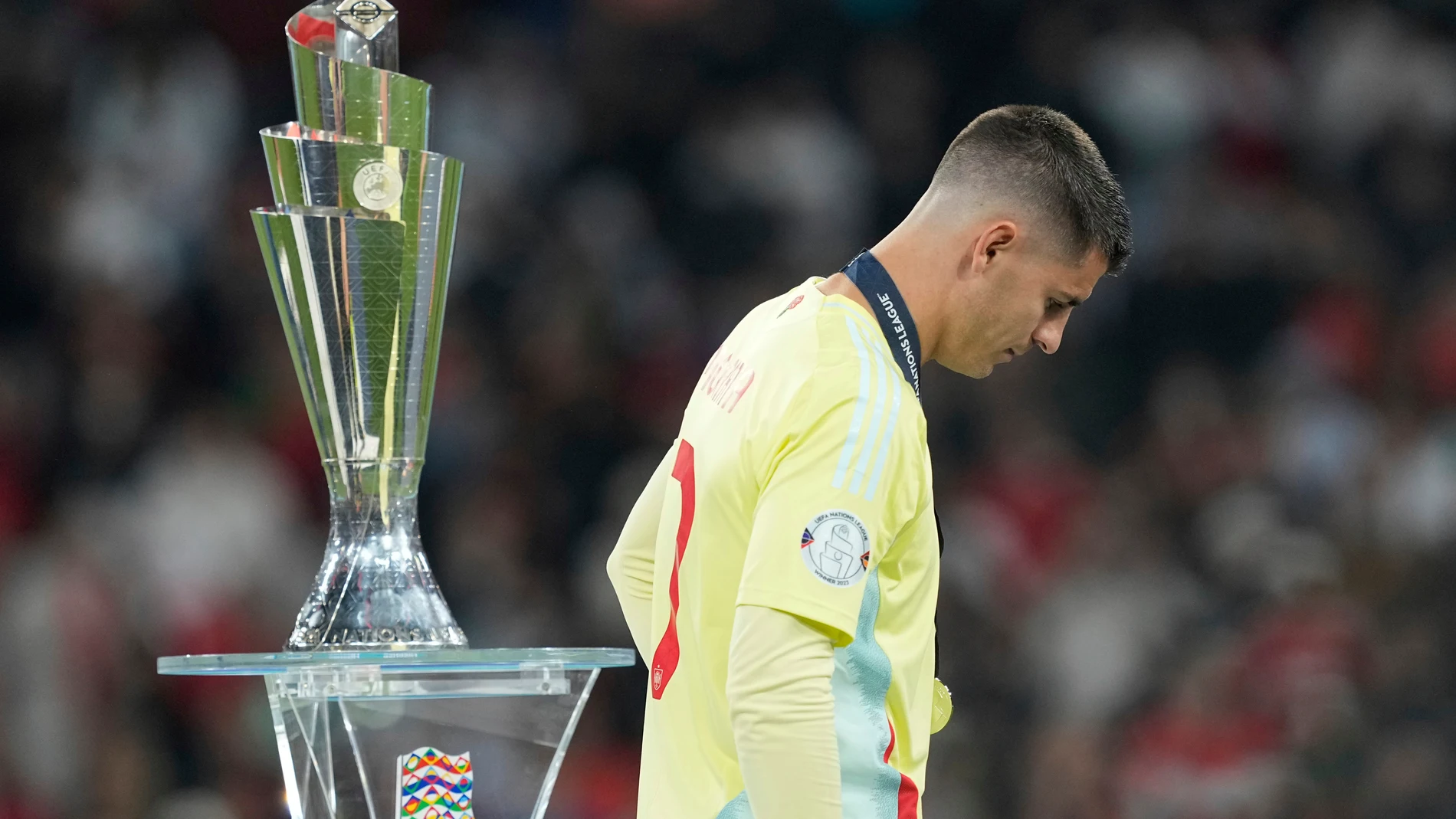 Spain's Alvaro Morata walks past the trophy after received his second place medal during the Nations League final soccer match between Portugal and Spain at the Allianz Arena in Munich, Germany, Monday, June 9, 2025. (AP Photo/Martin Meissner)