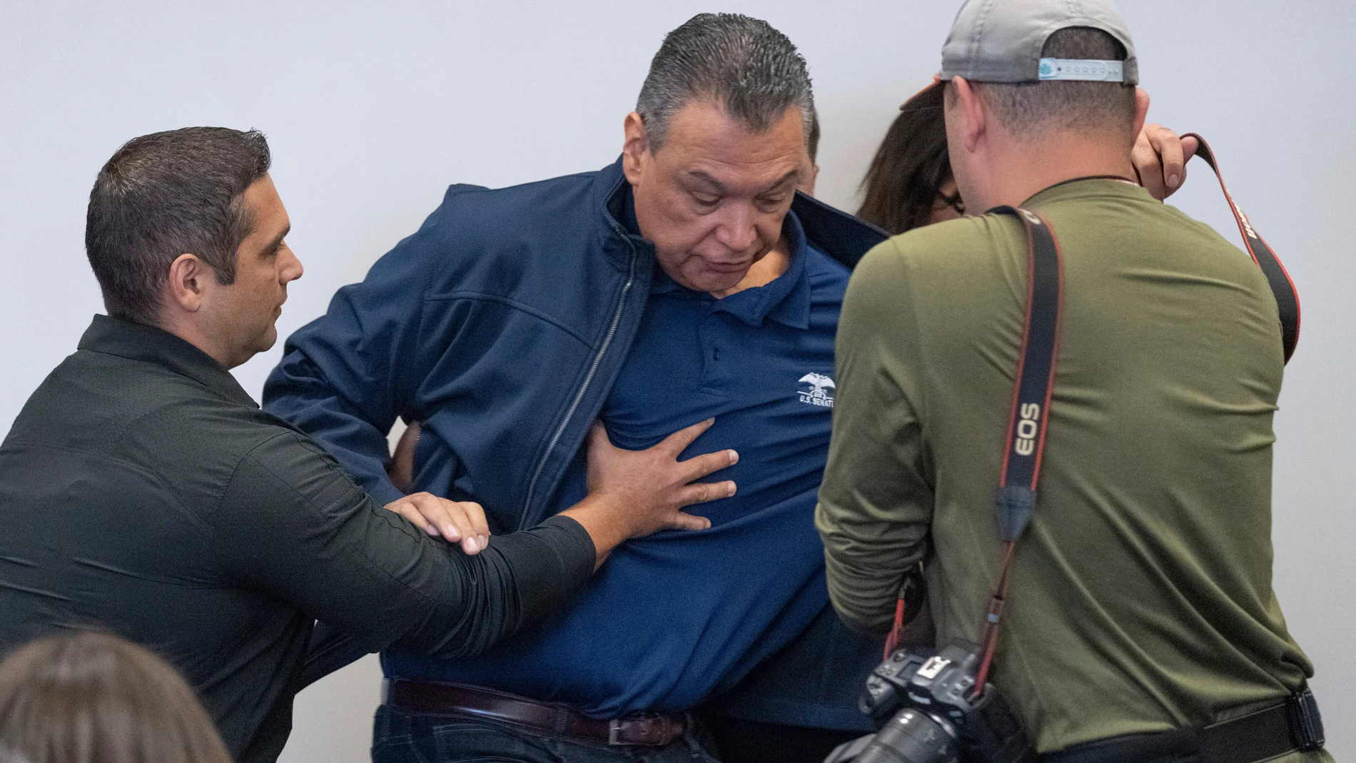 U.S. Sen. Alex Padilla, D-Calif., is pushed out of the room as Homeland Security Secretary Kristi Noem holds a news conference regarding the recent protests in Los Angeles, Thursday, June 12, 2025. (David Crane/The Orange County Register via AP)